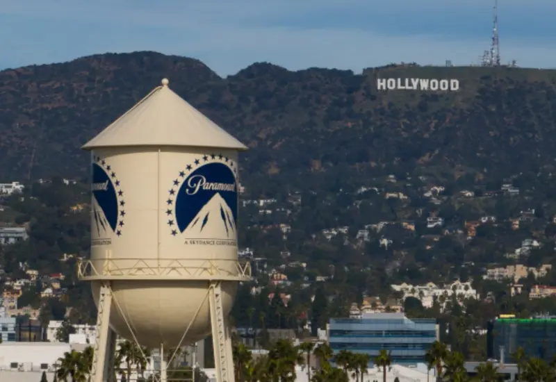 Logotipos de Paramount y Warner Bros juntos, ilustrando la operación de 110 mil millones de dólares que redefine la industria del cine.